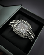 Silver watch with gemstones in a black box