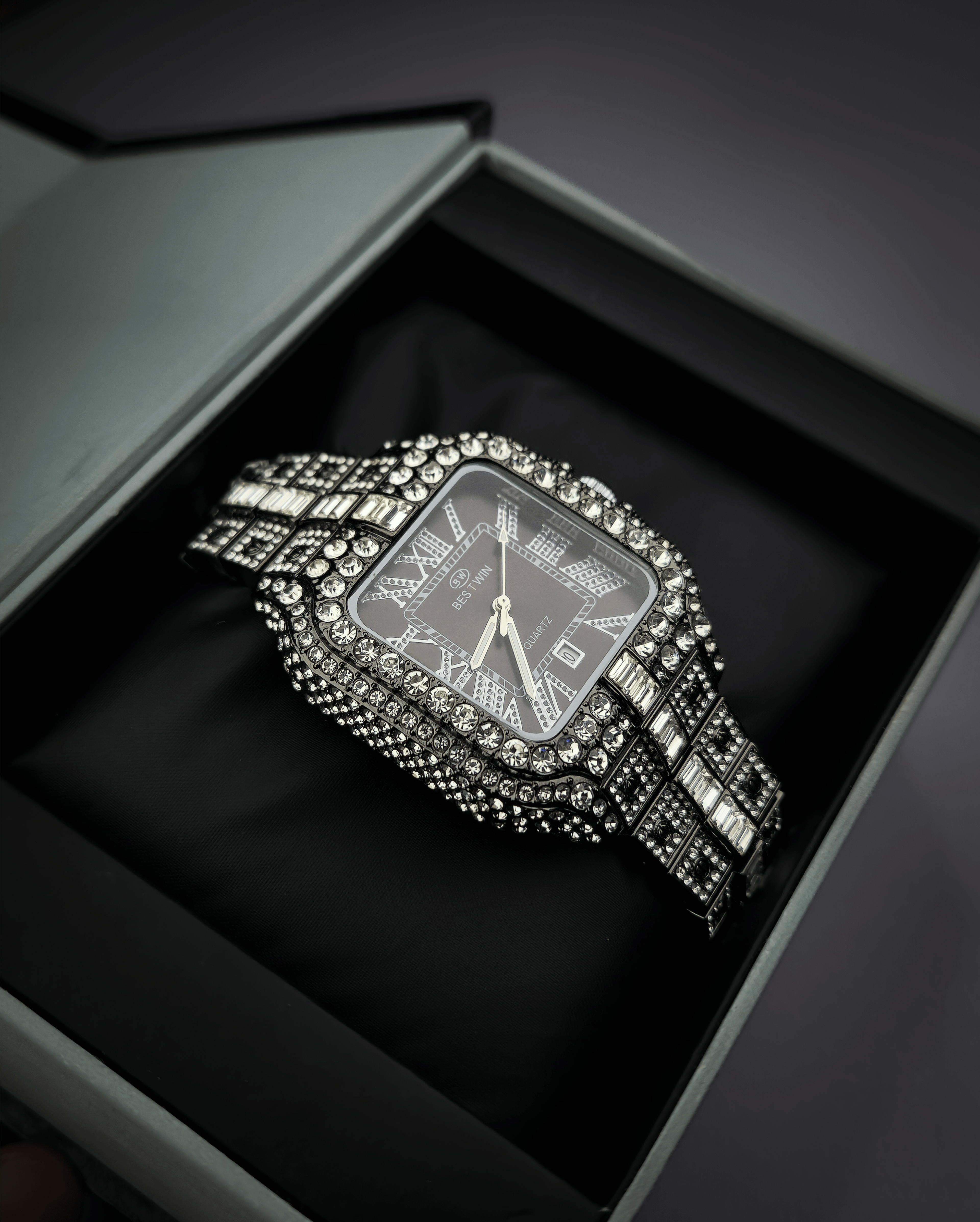 Silver watch with gemstones in a black box